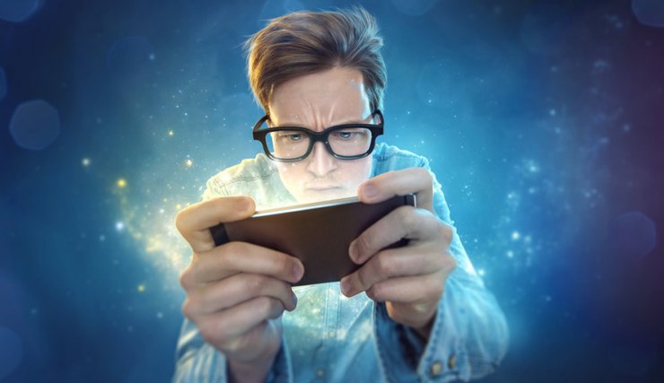 Guy Playing Game On Mobile